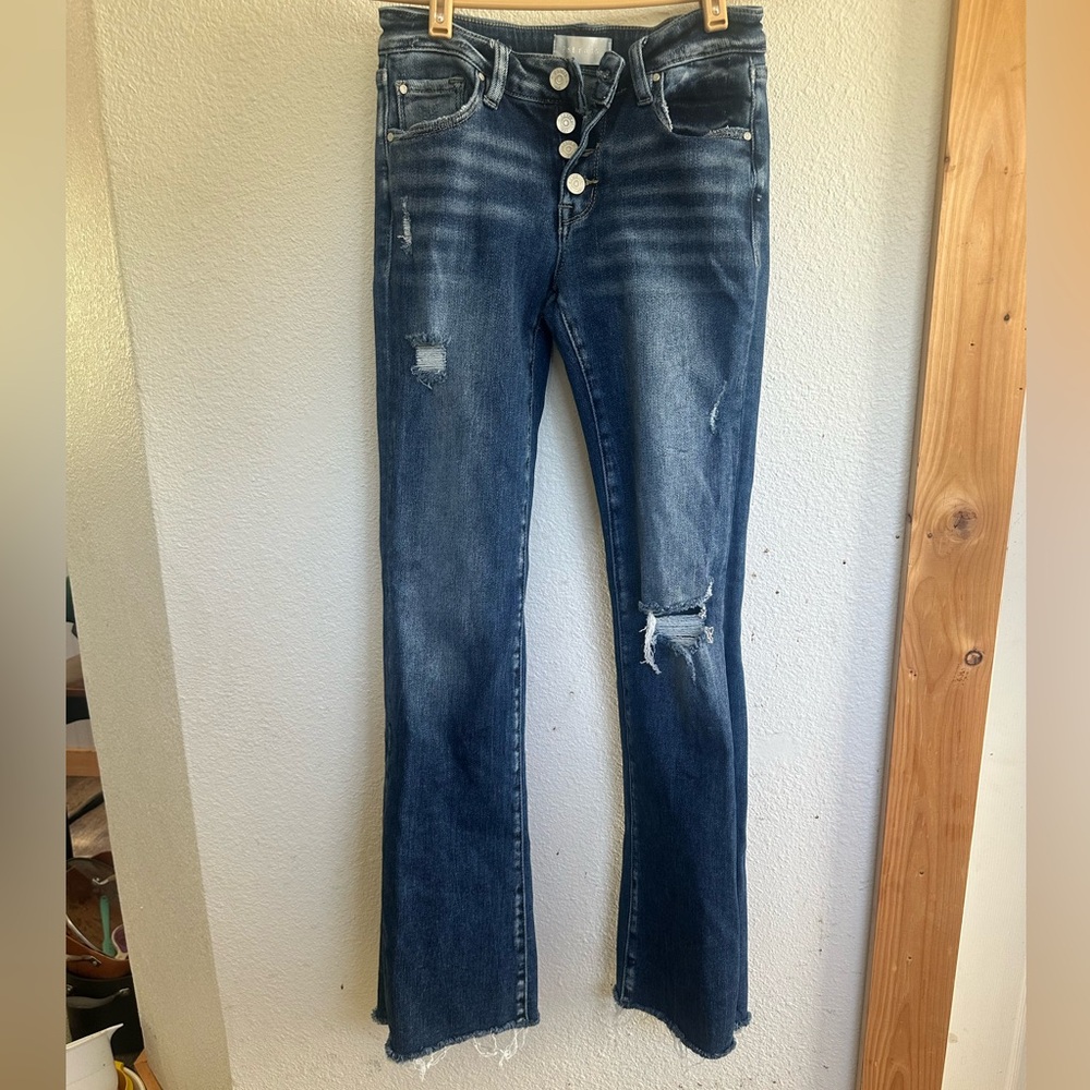 Classic Blue Flare Jeans with Distressed Details